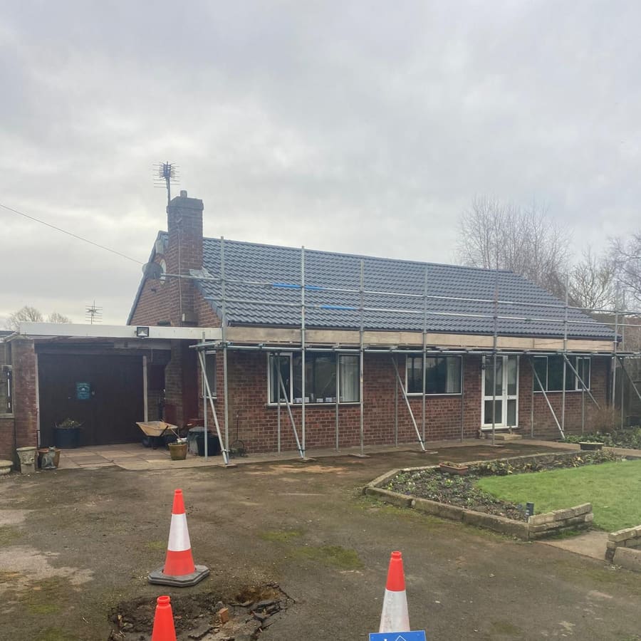 Scaffolding up around the bungalow ready to start