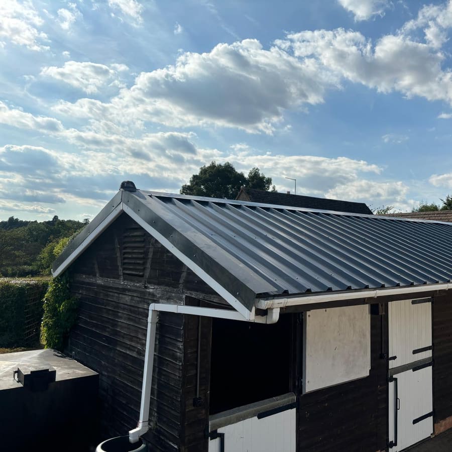 The outbuilding with its new roof finished