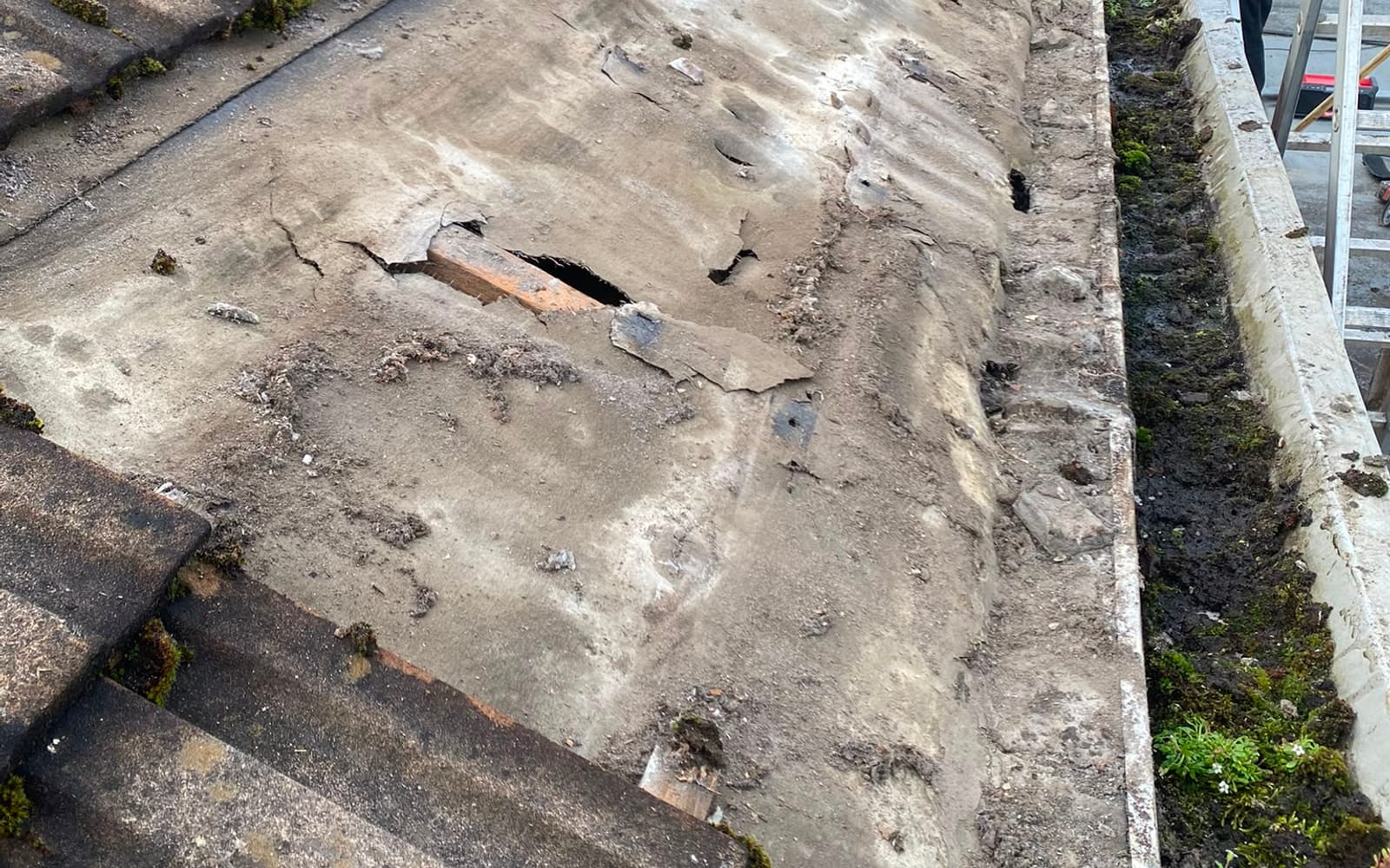 A badly damaged roof needing urgent repair