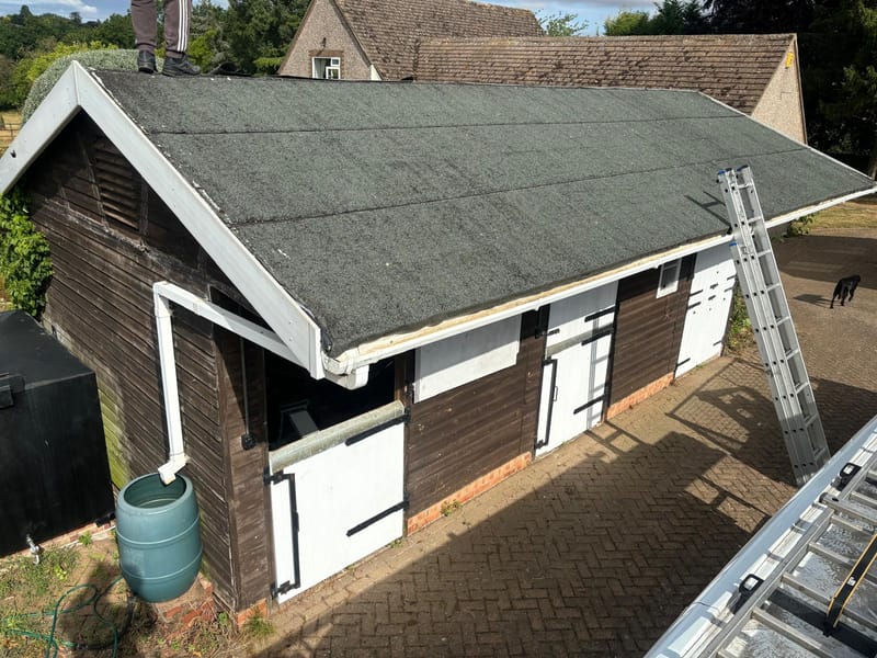 An outbuilding roof needing replacement
