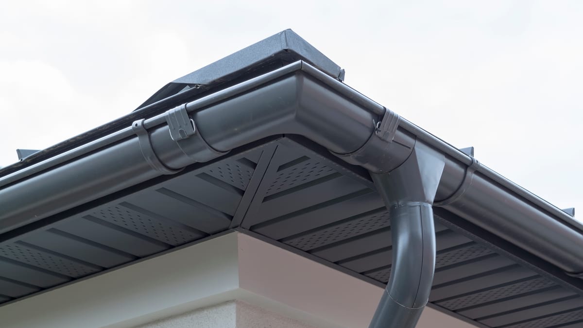 New white soffits and grey guttering on a house