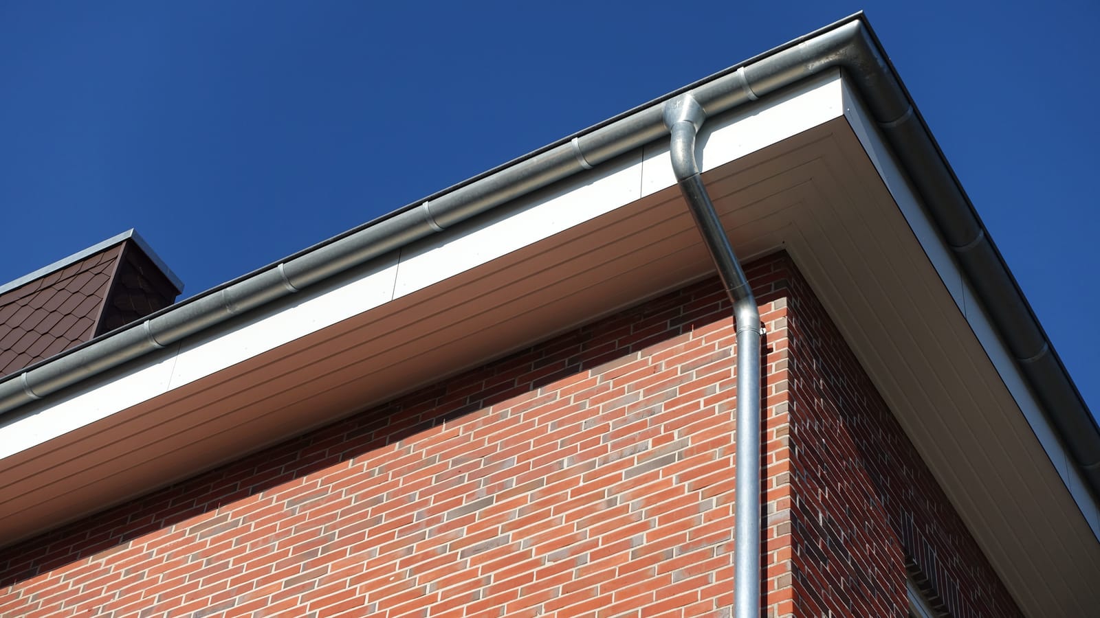 New white soffits and grey guttering on a house