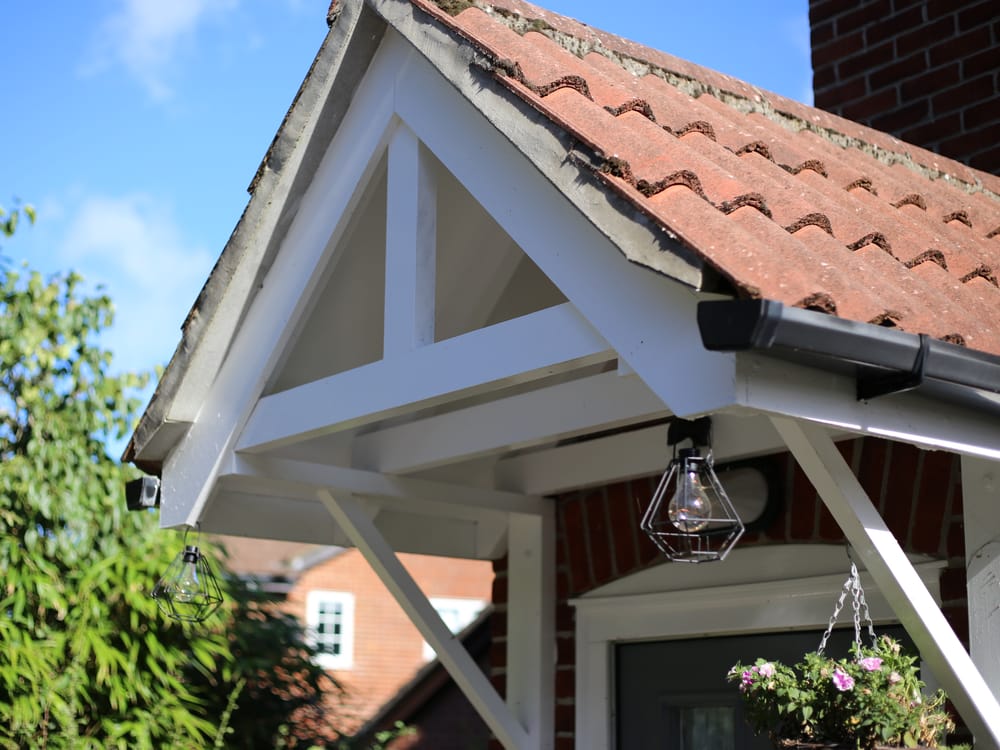 A white gable end with new fascias and guttering