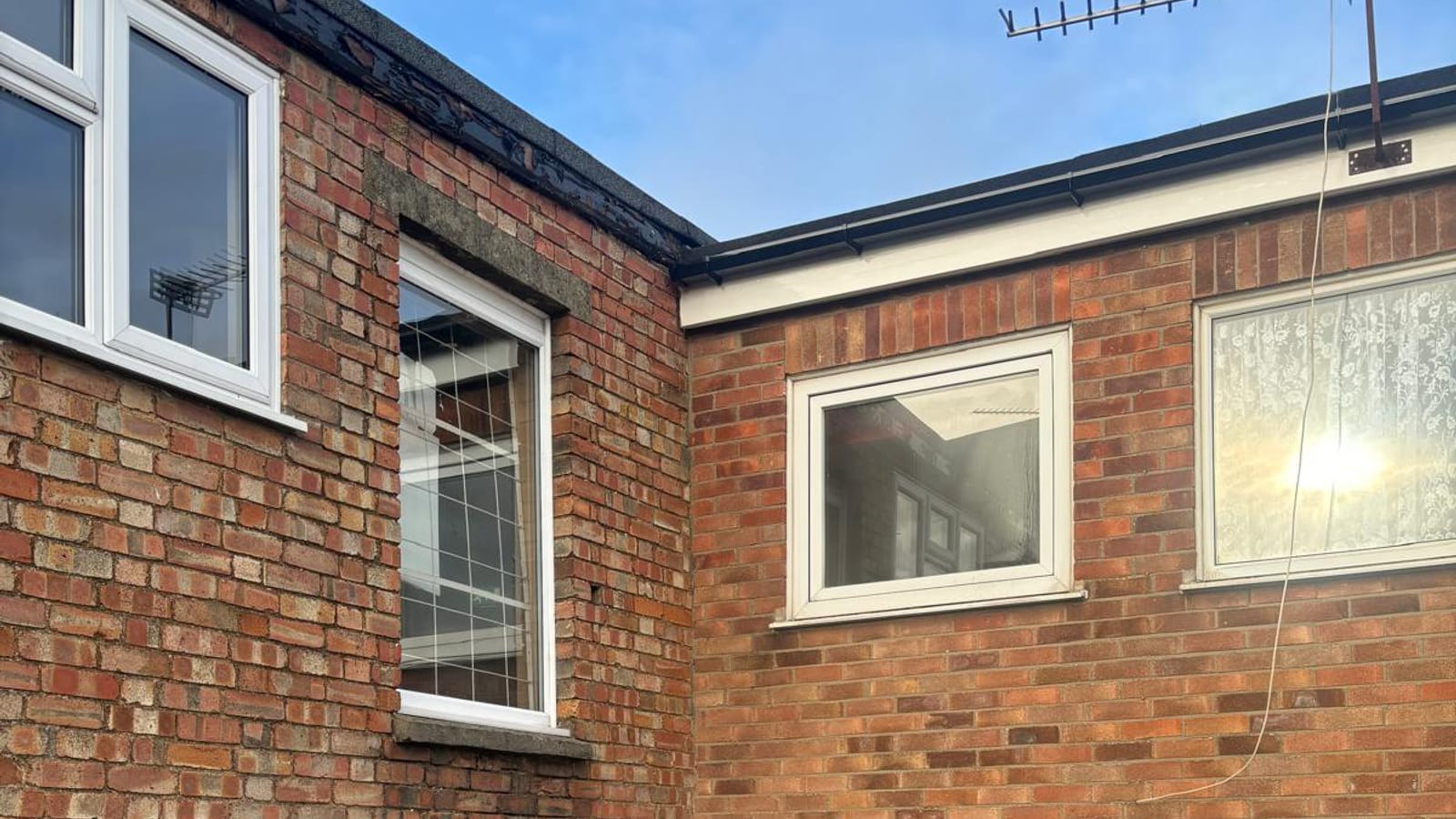 A house with a new flat roof over the bay