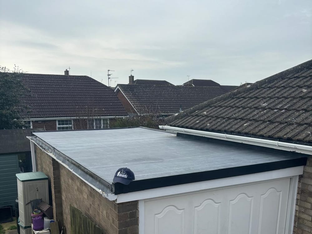 A finished EPDM rubber flat roof on a garage