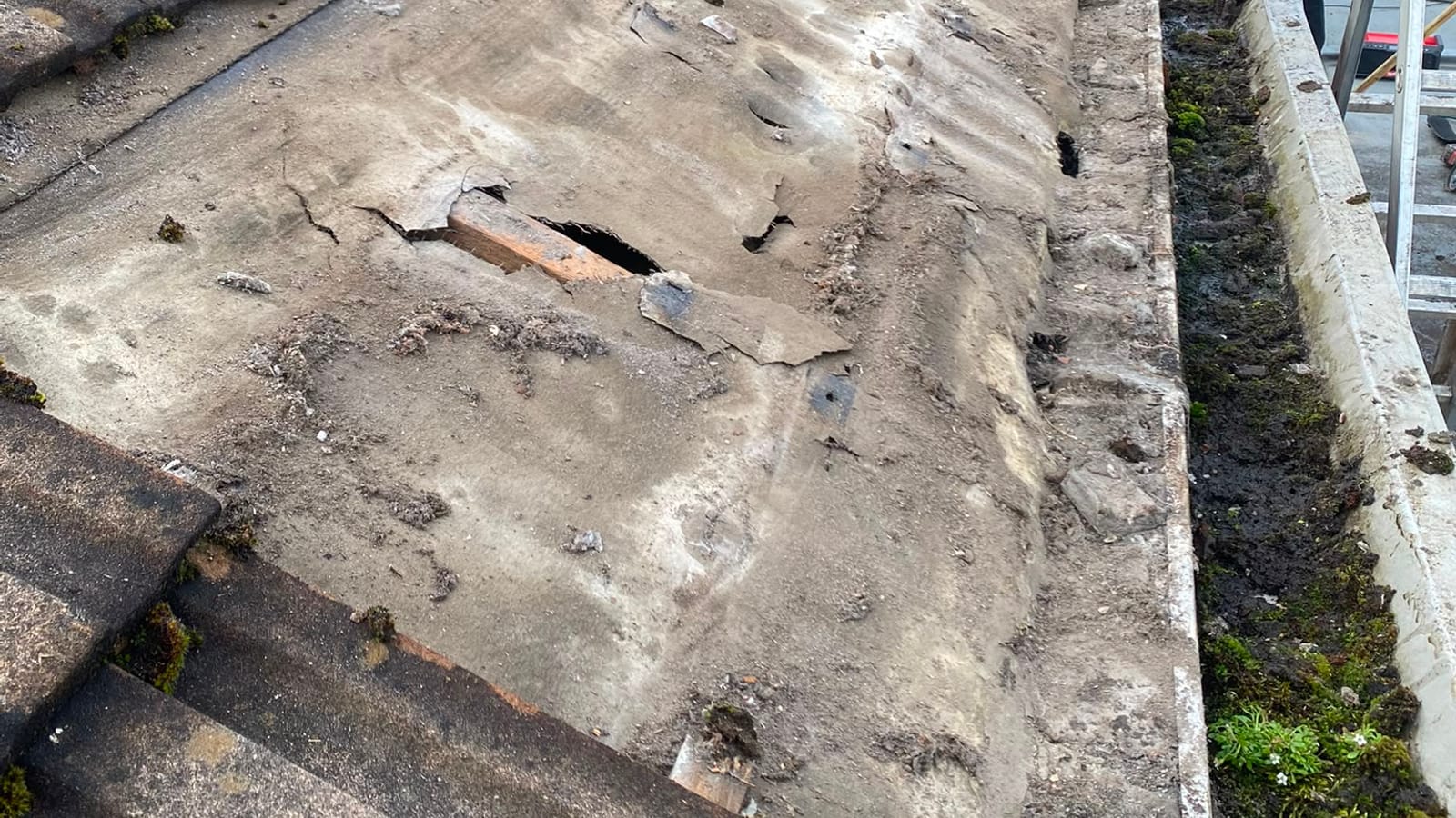 A damaged roof needing repair